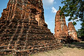 Ayutthaya, Thailand. Wat Mahathat, three auxiliary prang lined West East along the south enclosure wall of the main prang. 